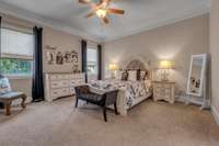 The Owners Suite is located on the first floor and near the Laundry Room.  Crown molding sets off the space and don't miss the huge walk in closet.