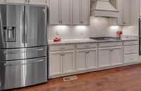 You will love cooking in this large kitchen!  Tons of cabinets and counters, Breakfast Bar, Granite Tops and Stainless Steel Appliances with Gas cooktop and Double ovens.