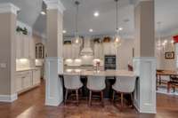 Just a few features are - Under cabinet Lighting, High Arc Faucet, finished Wood floors, and Crown Molding.