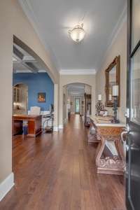 Welcoming foyer with Finished Wood floors and 10 foot ceilings on the first floor.