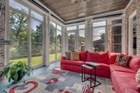Ez Breeze Windows extends the use of this sunroom and the windows lift to create a screened porch on those nice breezy days.