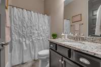 Full bath located on the first floor next to bedroom 2.