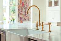 A touch of timeless luxury—this unlacquered brass faucet develops a rich patina over time, adding warmth and character to the heart of the home.
