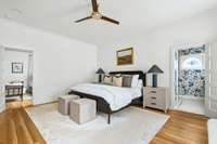 The spacious primary suite flows into a gem of a bathroom, rich in detail and design.