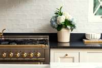 Every detail considered—from inset cabinetry and handmade tile to warm brass accents.