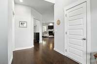 As you enter through the front door, the access to the attached garage is through the door on the right.