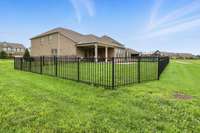 Sturdy black fence beautifully defines the space while providing a secure area to keep kids and pets safe at play.