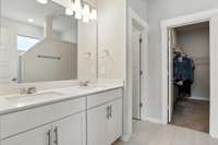 Beyond the primary en-suite is a large walk-in closet