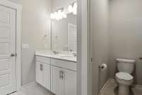 Well-lit double vanities with great storage, and a separated private powder room
