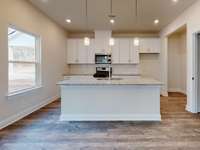 Photo is not of the actual home, but is an inspirational photo of builder’s model home and may depict options, furnishings, and/or decorator features that are not included