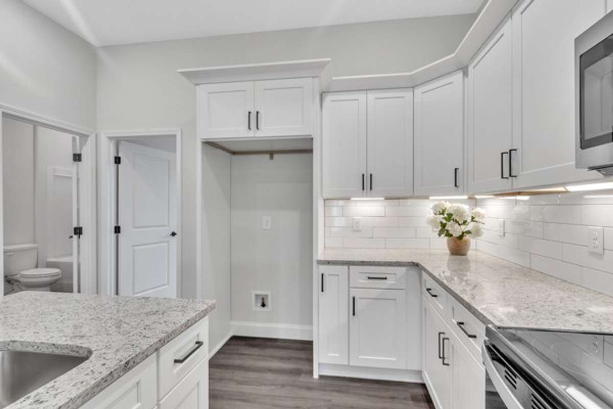 The guest bedroom is conveniently located just off the kitchen.