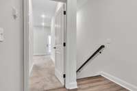 Top of 3rd floor landing where owner's retreat enters toward the front of home.