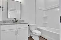 Full bathroom on the 2nd floor with modern decor, fixtures & lighting to serve guest bedroom and living area guests.