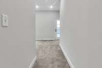 As you enter owner's retreat, you notice the soaring ceilings, multiple windows and lots of light streaming in with the primary bath and owner's walk-in closet to the left.