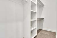 Custom closet provides plenty of room for owner's belongings.