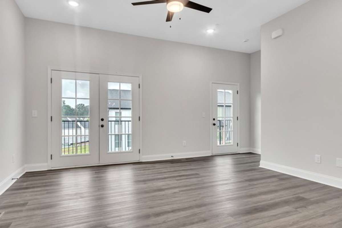 Check out the gorgeous wall of doors that fill the living area with light even without turning on the inside lighting.  An expansive deck runs the length of the living area and would be perfect to entertain guests and grow favorite flowers & herbs.