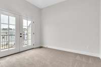 2nd guest bedroom with 10 ft high ceiling, modern ceiling fan & lighting with a private full bath.