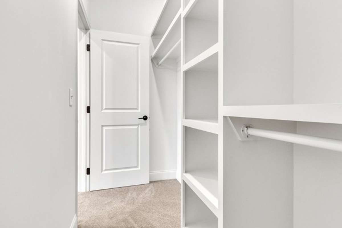 Another look at the owner's retreat custom closet.
