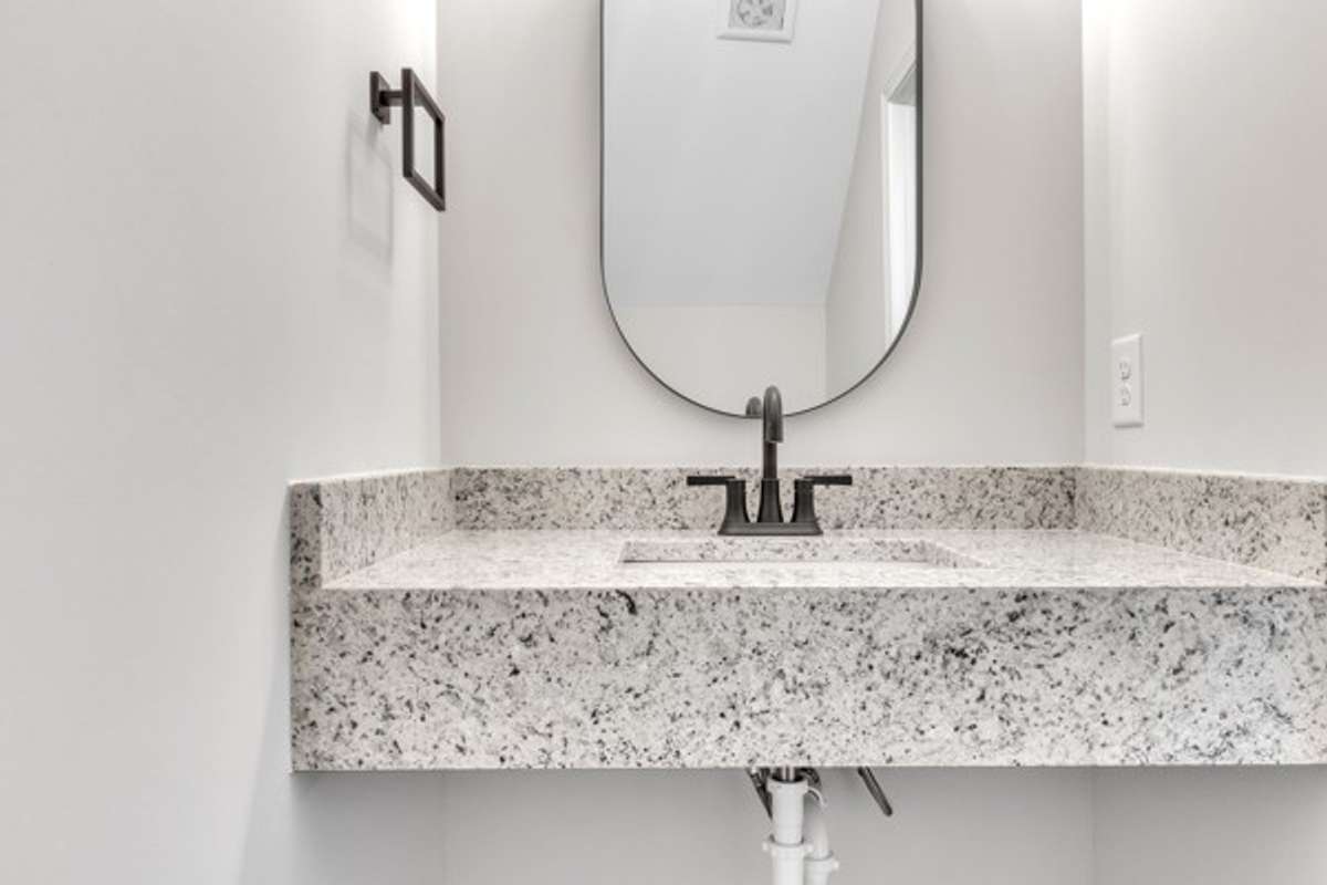 Half bath on 1st floor convenient to garage, office and front door.