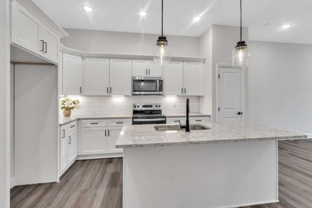 The 2nd floor features the kitchen, living space and a guest bedroom with a walk in closet and full bath on this floor.