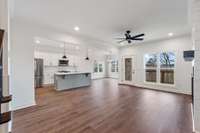 Living room, formal dining area off the back right, and covered deck
