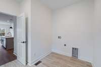 Laundry room is large enough for full size side by side W/D