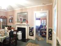 The doorway to the main Den or Living Room, may have been reversed in the past, Dining thru the doorway, Main Parlor at Front