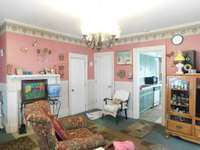 Two doorways, one to the second bath on the right, and to the left a storage closet