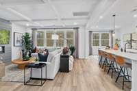 Open Great Room, Kitchen with large island, and breakfast nook.   Photos are of a Buchanan plan Model Home and for demonstration purposes. Colors and finishes will vary.