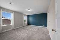 Spacious primary suite upstairs
