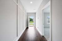 The foyer greets you with custom trim work.