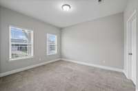 Downstairs secondary bedroom or office, with a huge closet!