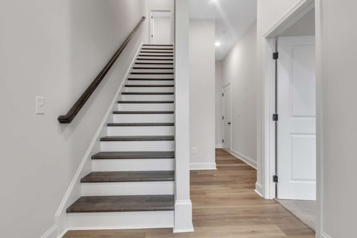 Come on in! Just on the entry foyer is the entry door leading to a private guest bedroom split off from the other bedrooms and living spaces.