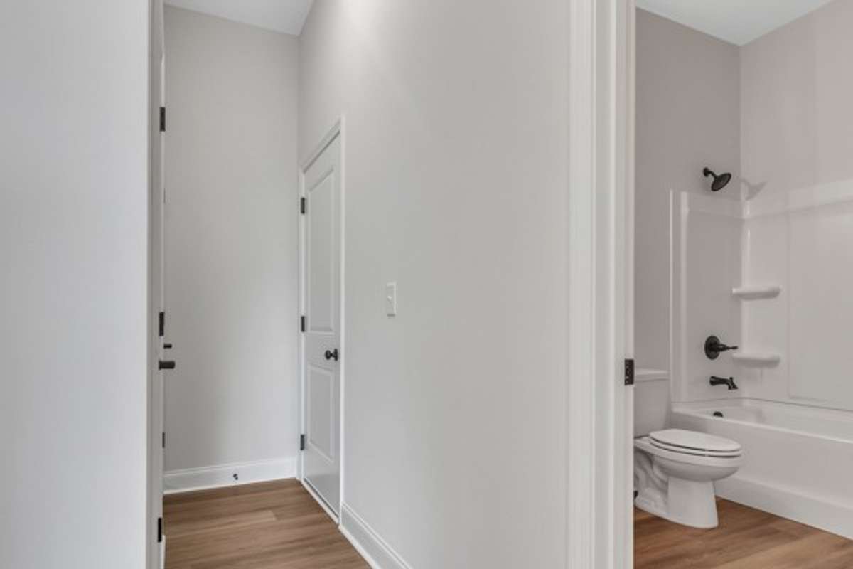 Entry foyer leads on to a full bath and entry to the 2 car garage.