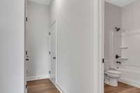 Entry foyer leads on to a full bath and entry to the 2 car garage.