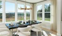 ***Photo taken from previously built Hopewell model home***  The bright and airy sunroom offers the ideal setting for casual meals or morning coffee.