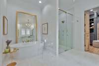Soaking tub, large shower and spacious walk in closet complete the en-suite primary bath