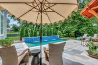 Gunite heated pool with 3 waterfalls and accent lighting provide great fun and relaxing atmosphere.
