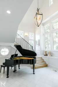 Perfect room for your piano- note round accent window.