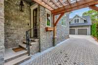 Friends entrance off of driveway. Driveway constructed with pervious pavers.