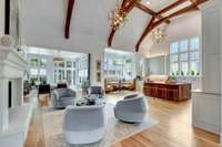 Living Room, kitchen and banquet. Notice the beautiful custom beams.