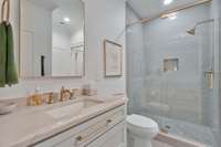 En-suite bath for Bedroom #3 also opens to den.