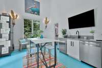 Art Studio/Pool House - features 20 Ft. ceiling, 2 Sets of French Doors, bar, dishwasher, Sub Zero refrigerator, Awesome natural light, fun Currey  light fixtures, painted floor and half bath