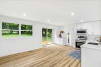 bright kitchen, new floors, cabinetry, quartz countertops, windows, appliances included and  more natural light
