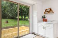 Pantry with additional storage. Access to new deck and fenced in back yard.