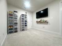 Finished study room with additional storage space in closet