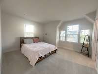 Bedroom 2 has 4 windows for beautiful natural light, plus a walk in closet.