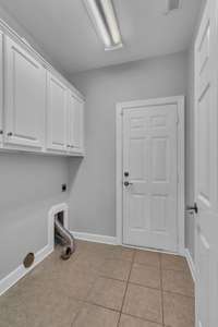 Mudroom, laundry with tile flooring