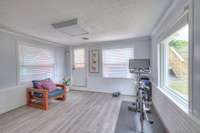 One of the secondary bedrooms is currently being used as an exercise room.