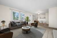 Living room and eat-in kitchen have been virtually staged